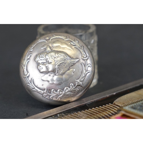 310 - A collection of hallmarked sterling silver items to include a silver topped glass jar featuring Reyn... 