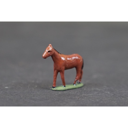 316 - A small collection of vintage metal and wooden animal figures to include cold painted dogs.