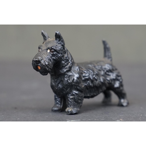 316 - A small collection of vintage metal and wooden animal figures to include cold painted dogs.