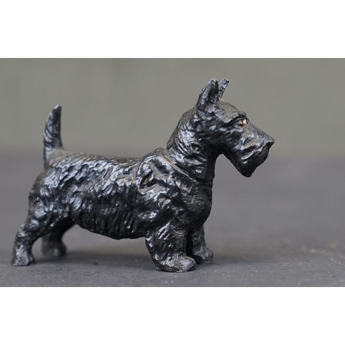 316 - A small collection of vintage metal and wooden animal figures to include cold painted dogs.