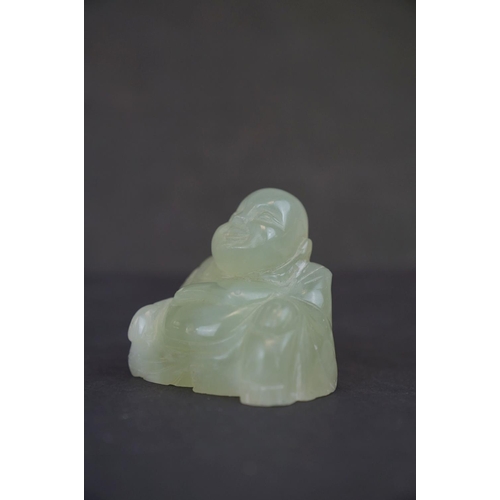 317 - Two carved Jade Buddha figures together with a carved Jade Buddha amulet.