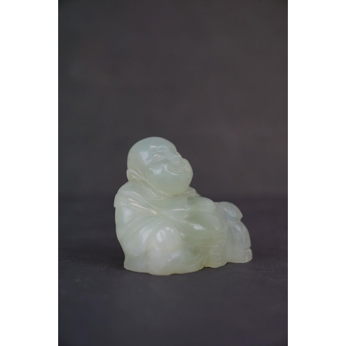 317 - Two carved Jade Buddha figures together with a carved Jade Buddha amulet.