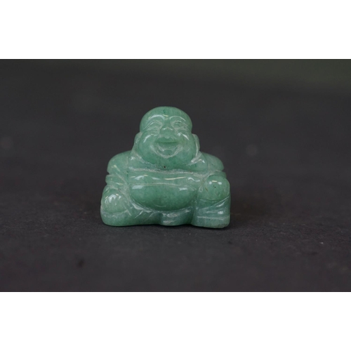 317 - Two carved Jade Buddha figures together with a carved Jade Buddha amulet.