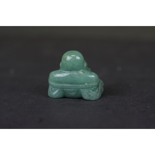 317 - Two carved Jade Buddha figures together with a carved Jade Buddha amulet.