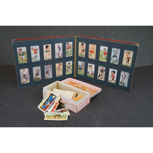 336 - A collection of mixed cigarette cards and tea cards to include albums.