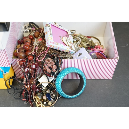 344 - A collection of mainly contemporary costume jewellery contained within four boxes.