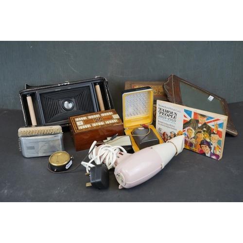 351 - A box of mixed collectables to include a leather framed mirror, a vintage volt meter and a vintage K... 