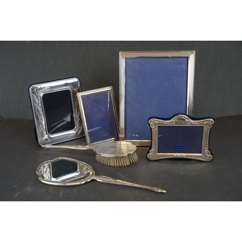 354 - A collection of hallmarked sterling silver photograph frames together with a hallmarked sterling sil... 