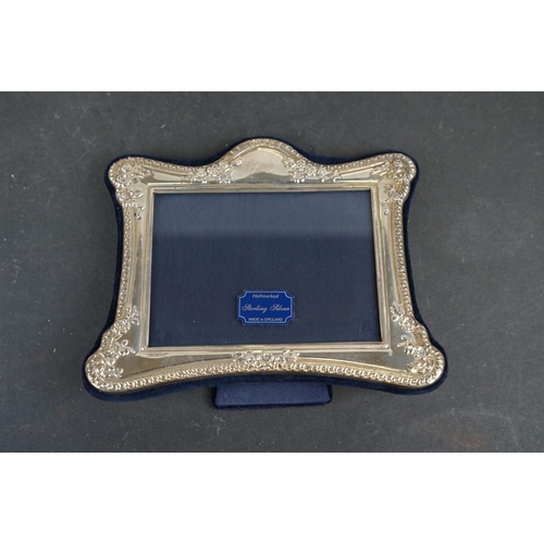 354 - A collection of hallmarked sterling silver photograph frames together with a hallmarked sterling sil... 