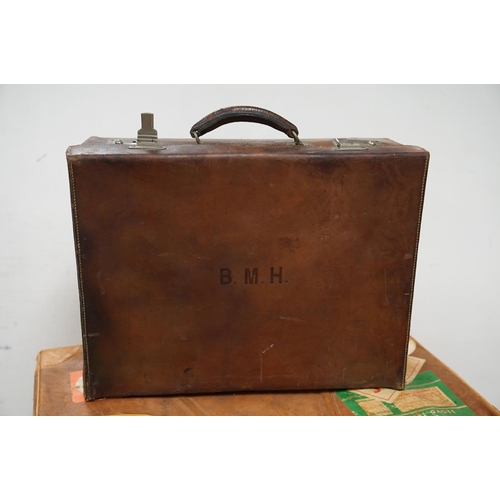 449 - Four vintage suitcases, to include demob example, others with travel stickers attached