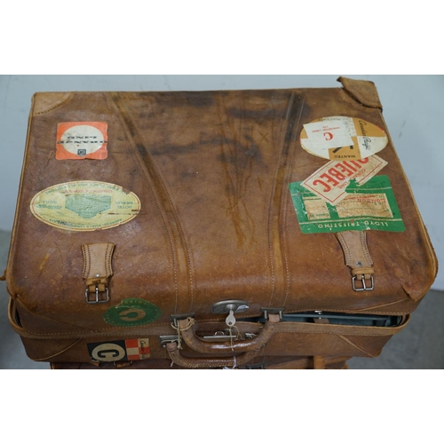 449 - Four vintage suitcases, to include demob example, others with travel stickers attached