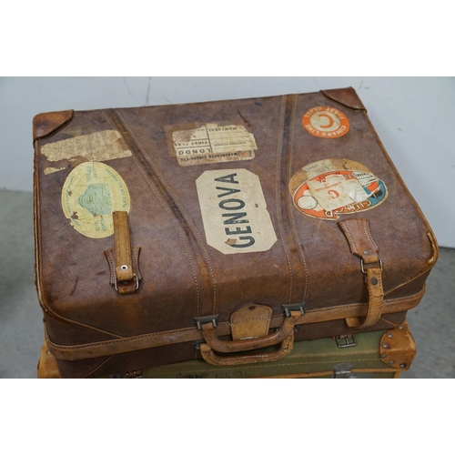 449 - Four vintage suitcases, to include demob example, others with travel stickers attached