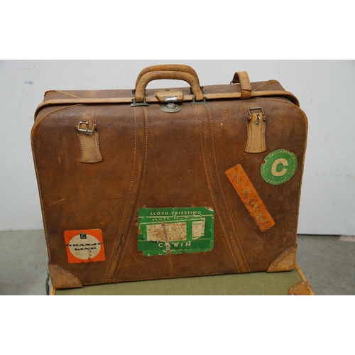 449 - Four vintage suitcases, to include demob example, others with travel stickers attached