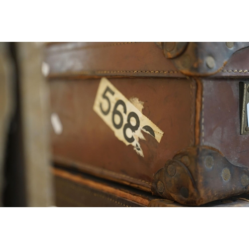 450 - Three vintage suitcases to include two leather examples