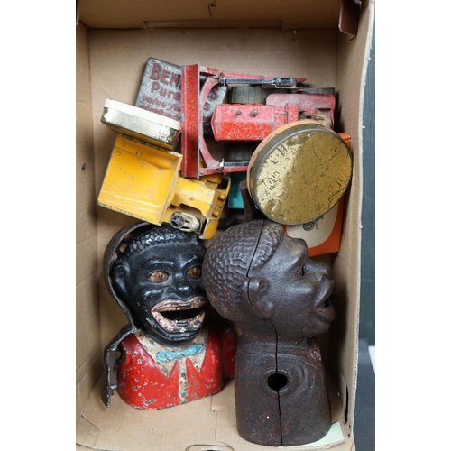 463 - A box of mixed collectables to include battery operated robots, iron money boxes and Dinky diecast v... 