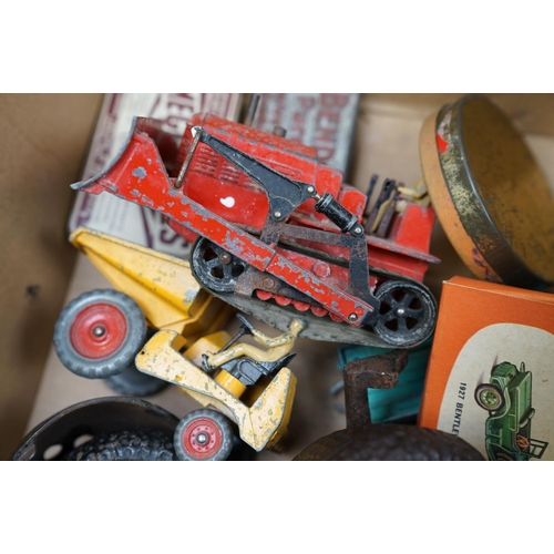 463 - A box of mixed collectables to include battery operated robots, iron money boxes and Dinky diecast v... 