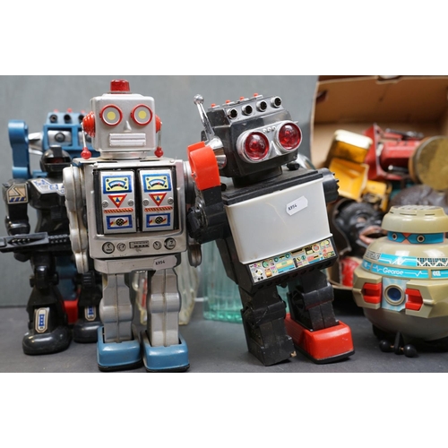 463 - A box of mixed collectables to include battery operated robots, iron money boxes and Dinky diecast v... 