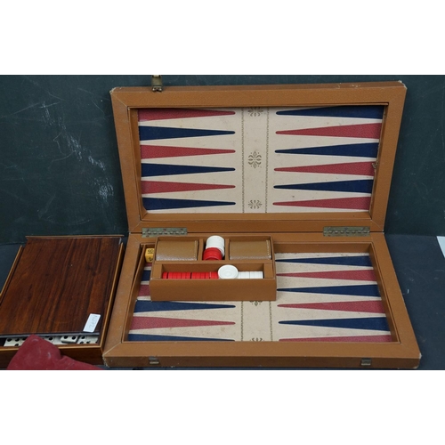 494 - A collection of vintage games to include Backgammon and bone dominos together with a set of rune sto... 