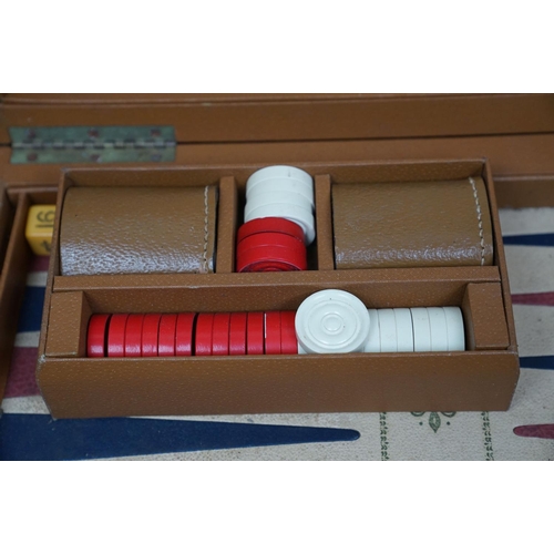 494 - A collection of vintage games to include Backgammon and bone dominos together with a set of rune sto... 