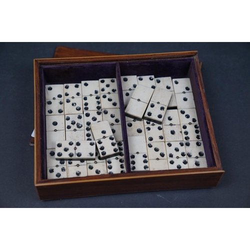 494 - A collection of vintage games to include Backgammon and bone dominos together with a set of rune sto... 