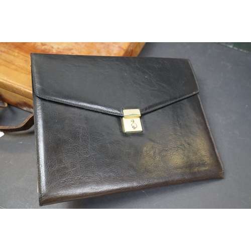 495 - A collection of leather collectables to include a vintage brief case, leather bound memo book, leath... 