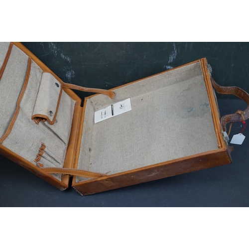 495 - A collection of leather collectables to include a vintage brief case, leather bound memo book, leath... 