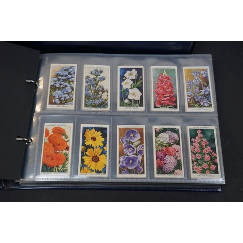 501 - A large quantity of vintage cigarette cards covering various subjects to include Will's and Player's... 