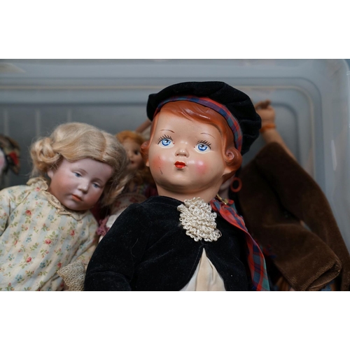 502 - A collection of vintage dolls to include ceramic examples.