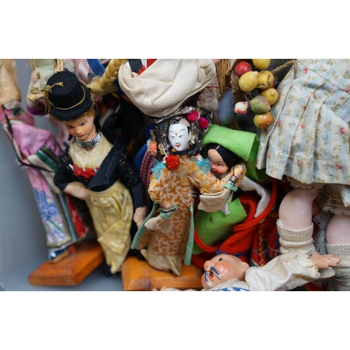 502 - A collection of vintage dolls to include ceramic examples.