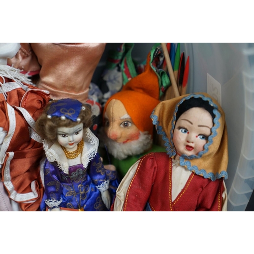 502 - A collection of vintage dolls to include ceramic examples.