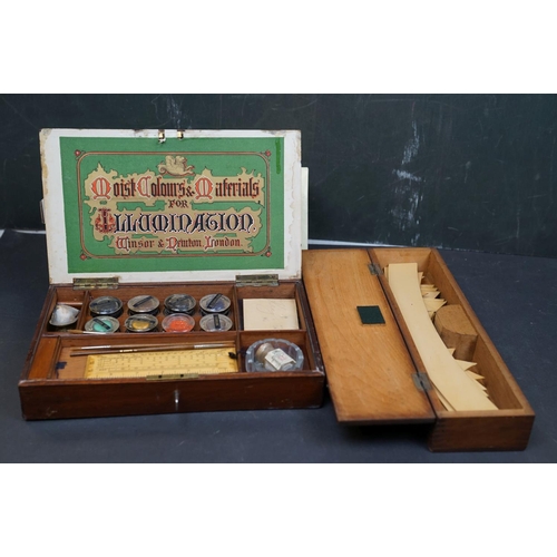 503 - A collection of vintage art supplies and drawing equipment within wooden boxes.