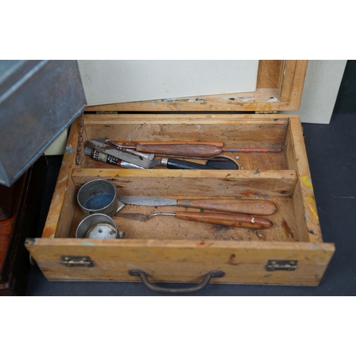 503 - A collection of vintage art supplies and drawing equipment within wooden boxes.