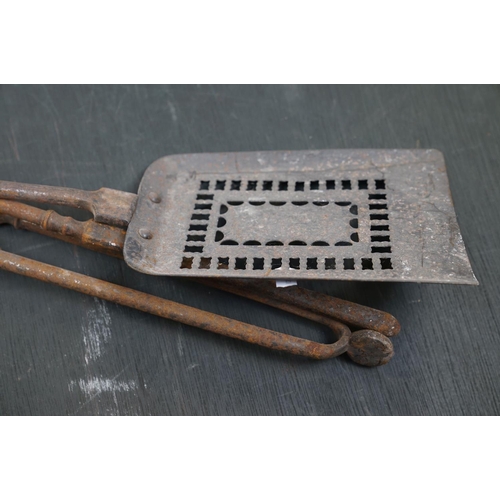 505 - A vintage iron three piece fire tool companion set comprising of shovel, poker and tongs.