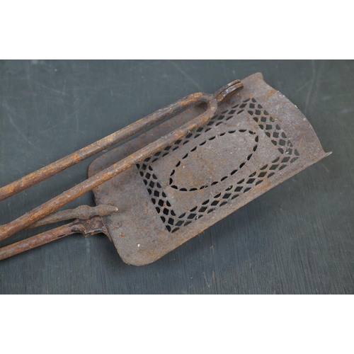 508 - A vintage iron three piece fire tool companion set comprising of shovel, poker and tongs.