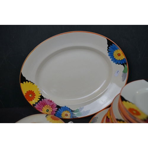 529 - A 1930's Royal Venton ware dinner service with hand painted floral decoration.