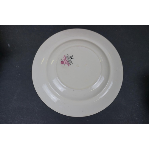 529 - A 1930's Royal Venton ware dinner service with hand painted floral decoration.