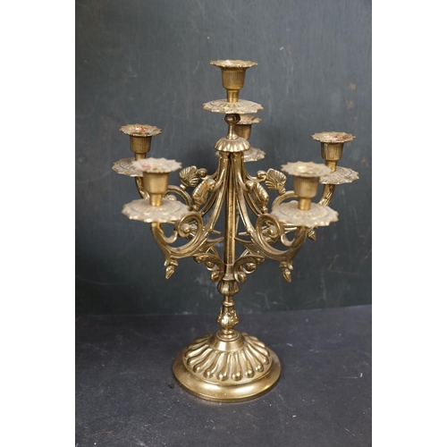 531 - A collection of assorted brass ware to include candlestick, letter rack and a watering can.