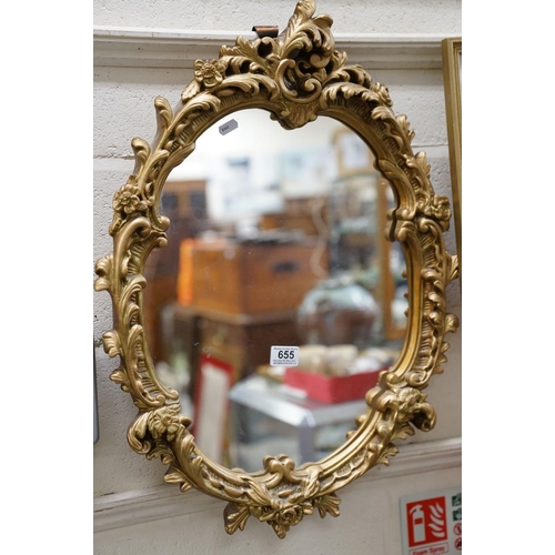 655 - 20th century Rococo style Gilt Oval Mirror, 67cms high