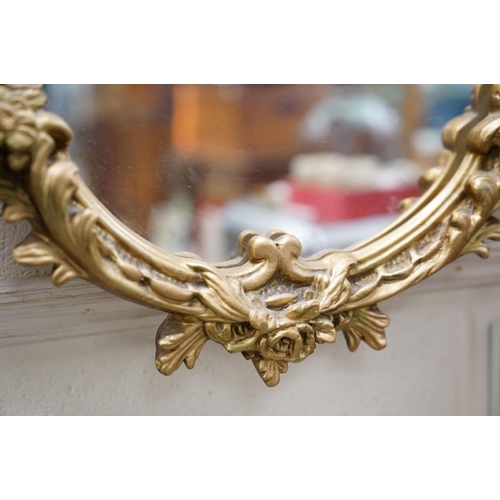 655 - 20th century Rococo style Gilt Oval Mirror, 67cms high