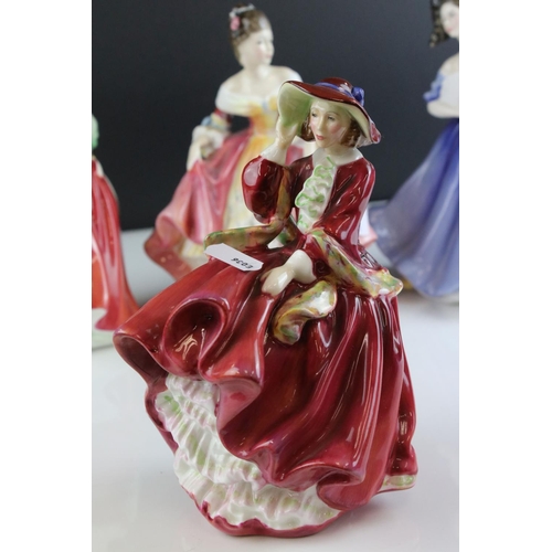 121 - Five Royal Doulton Figurines including Top o' the Hill, Fair Lady (red), Christmas Morn, Southern Be... 