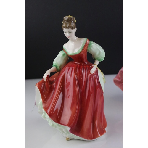 121 - Five Royal Doulton Figurines including Top o' the Hill, Fair Lady (red), Christmas Morn, Southern Be... 