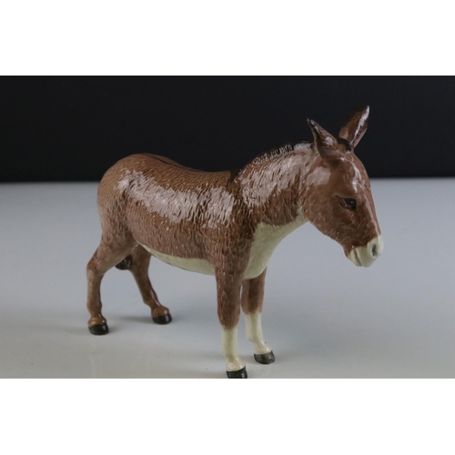 125 - Beswick Woolly Shetland Mare, model 1033, Beswick Donkey and a Ceramic Dog