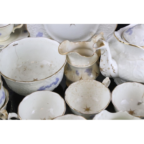 149 - 19th century matched Ceramic Tea Set, white body and raised lilac decoration, including teapot, milk... 