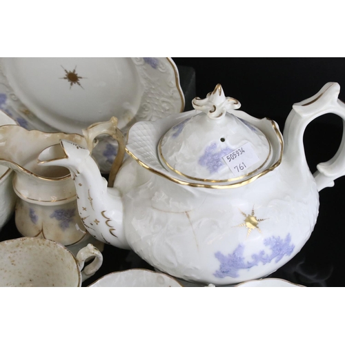 149 - 19th century matched Ceramic Tea Set, white body and raised lilac decoration, including teapot, milk... 