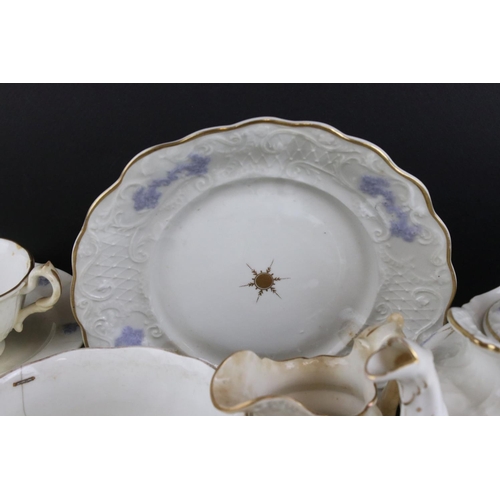 149 - 19th century matched Ceramic Tea Set, white body and raised lilac decoration, including teapot, milk... 