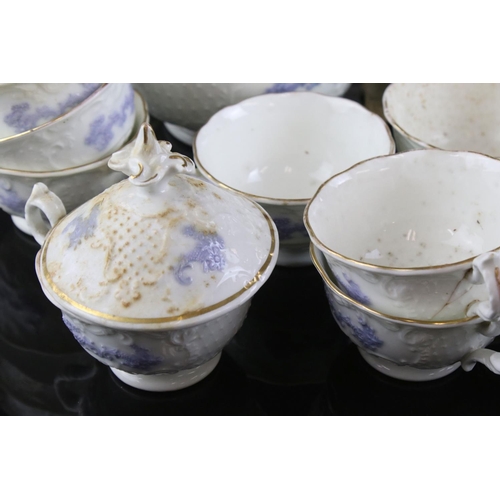 149 - 19th century matched Ceramic Tea Set, white body and raised lilac decoration, including teapot, milk... 