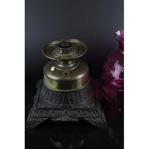 151 - Large Victorian Brass Oil Lamp with Dimpled Cranberry Glass Shade and held on a Large Square Cast Ir... 