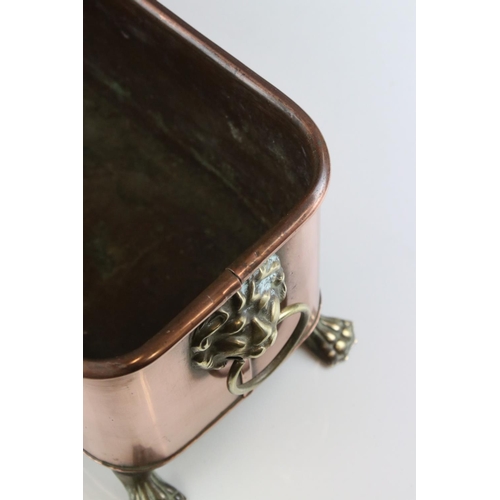 159 - Copper Rectangular Planter with Brass Lion Mask Ring Handles and raised on Four Brass Lion Paw Feet,... 