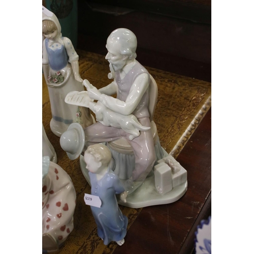 419 - A group of mainly Lladro figures to include Clowns and boy with teddy bear.