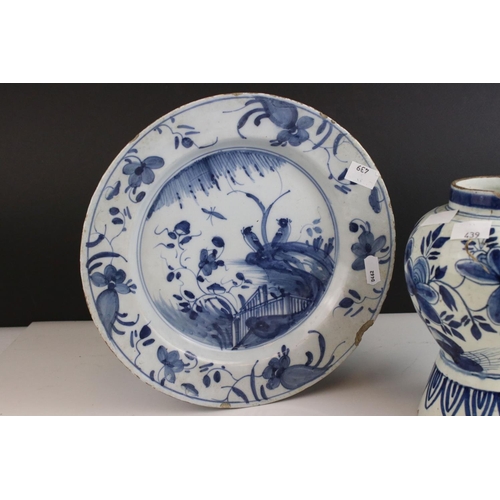 422 - Two English Delft blue and white plates and a Delft vase. Part of an extensive collection of items f... 